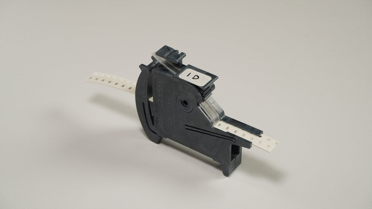8 mm SMD component tape loaded in an SMT Caddy MTI manual SMT tape feeder
