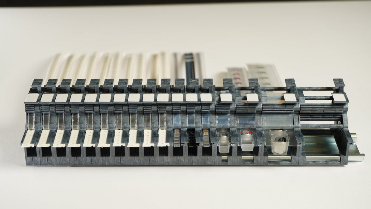 Molded MTI SMT tape feeders on 35 mm DIN rail, each feeder only 2 mm wider than its SMD tape