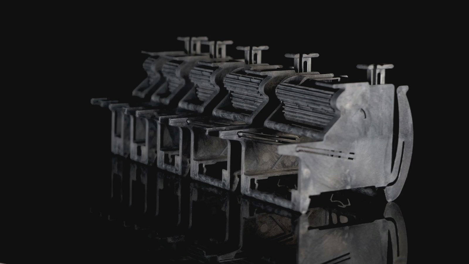 Five MTI tape feeders set for 8, 12, 16, 24 and 32 mm tape, seen from a slowly moving camera