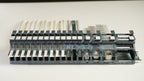 Front view of an MTI feeder bank on DIN rail showing pick points in a row, each feeder 2 mm wider than its tape
