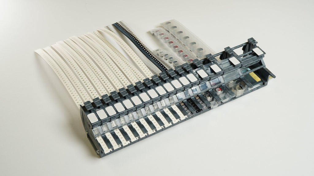 Seventeen MTI feeders on one 35 mm DIN rail: 8 mm units side by side, with 12, 16, 24 and 32 mm units at the end